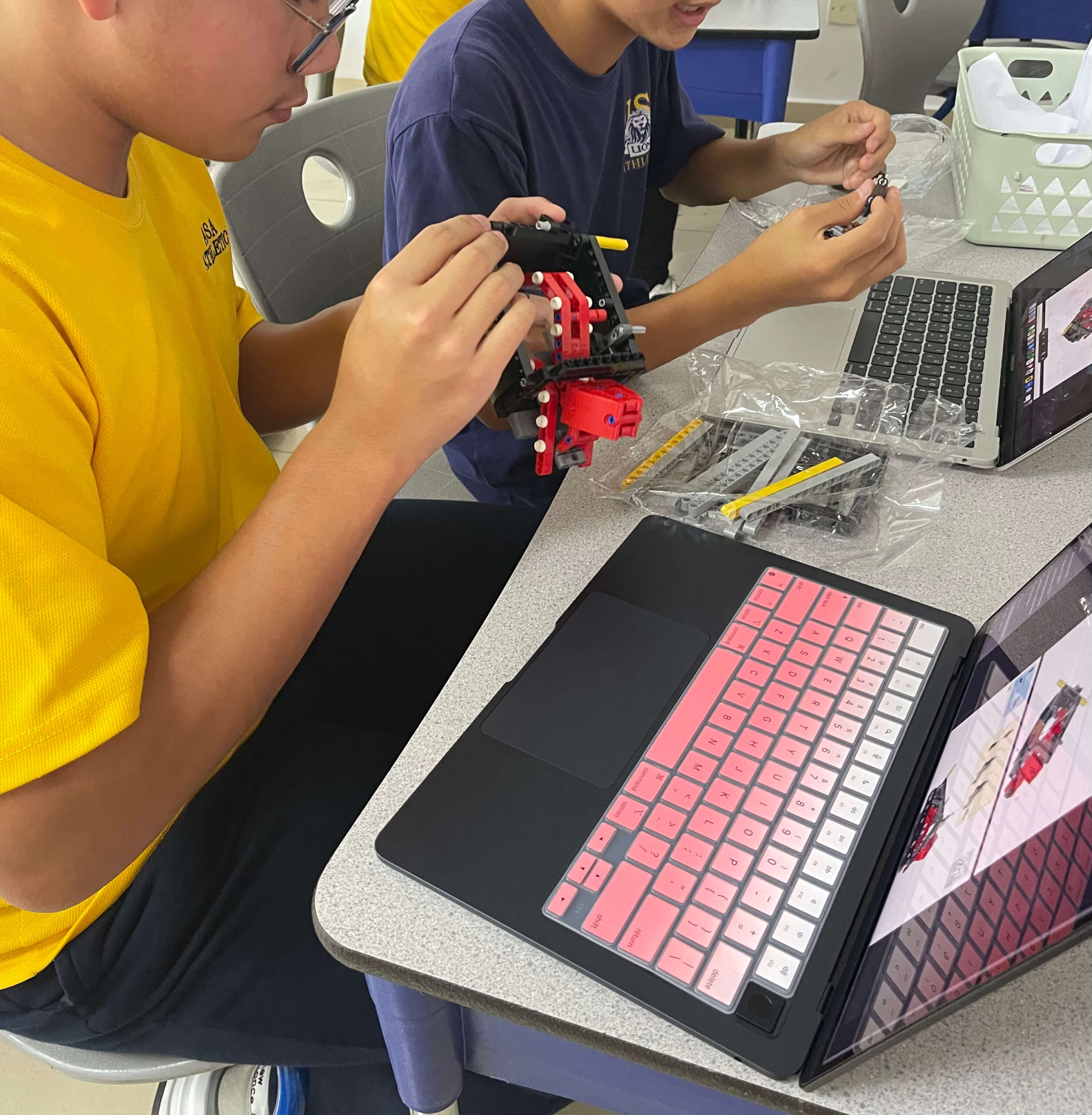 Students working in groups in one of Ms. Egbal's Lego Activity classes